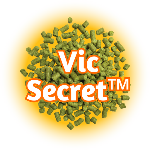 A close-up of AU Vic Secret™ Hops pellets against a yellow background, with the brand name 'Vic Secret TM' prominently displayed.