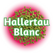 A close-up of EU Hallertau Blanc Hops, with pellets displaying a mix of green and red colors, and the text 'HALLETTAU BLANC' in the background.